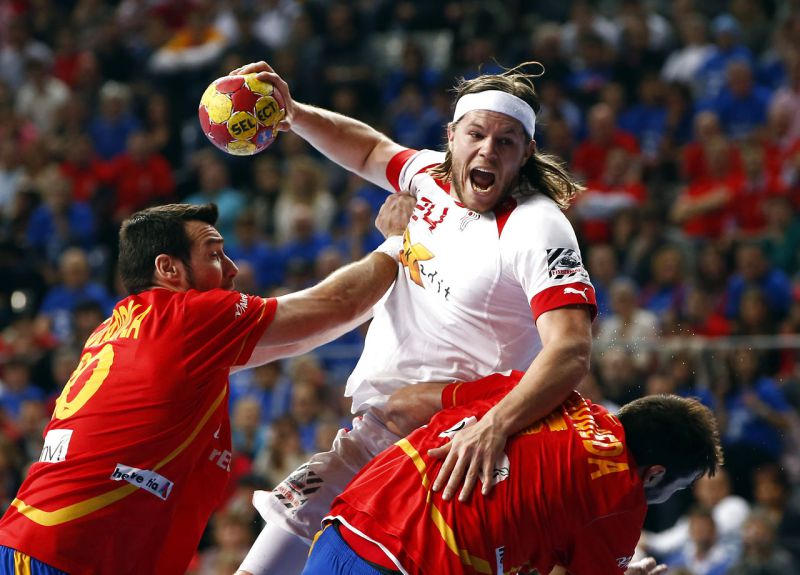 Denmark's Hansen is challenged by Spain's Guardiola during their Men's Handball World Championship final match in Barcelona